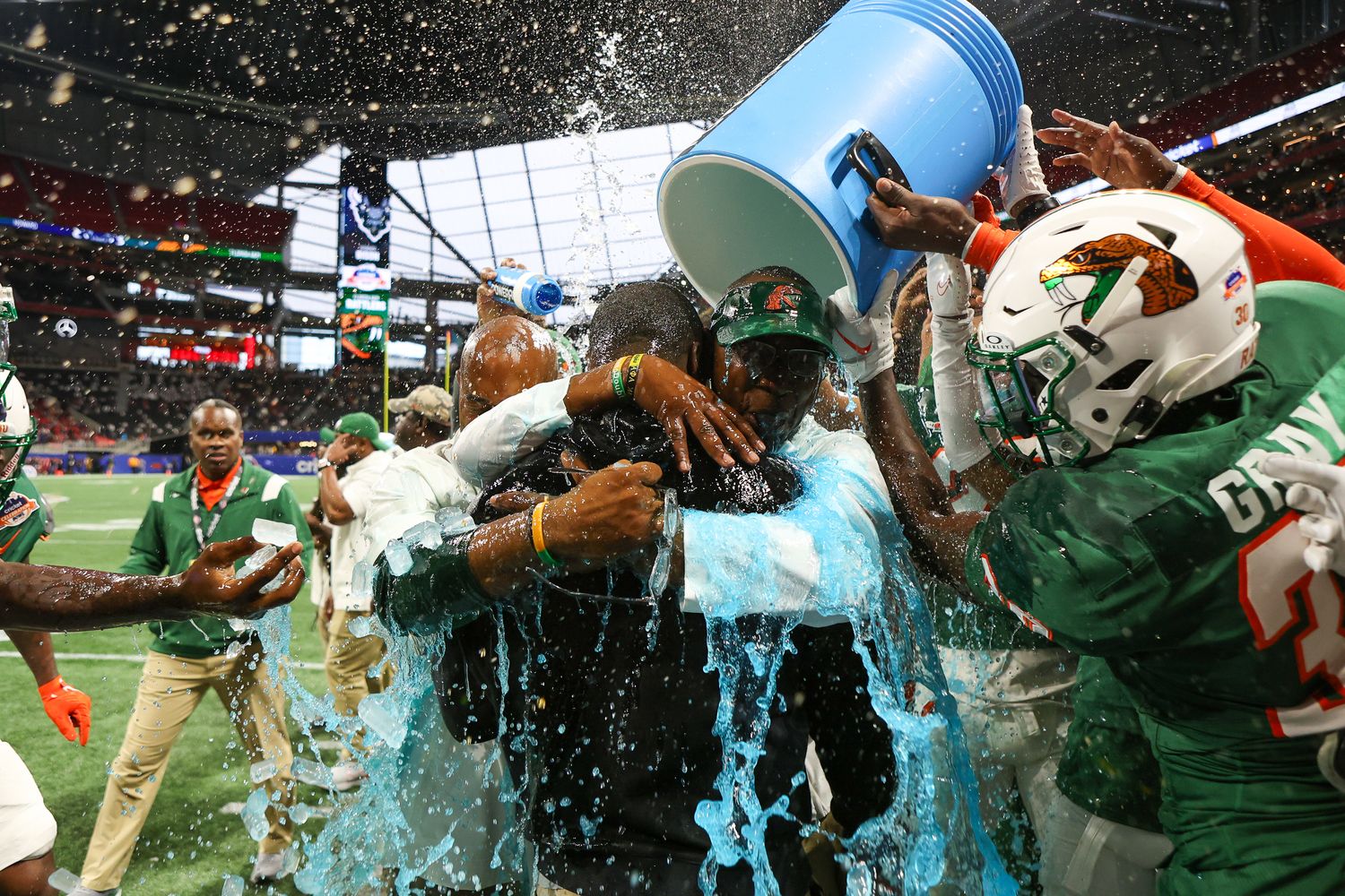 Dec 16, 2023; Atlanta, GA, USA; Florida A&M Rattlers head coach Willie Simmons is doused with a bucket against the Howard Bison in the second half at Mercedes-Benz Stadium.