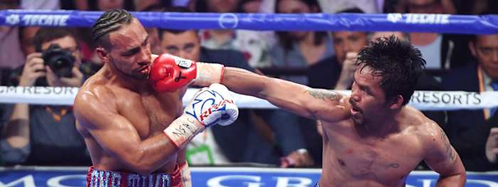LAS VEGAS, NEVADA - JULY 20: Manny Pacquiao (R) throws a right at Keith Thurman in the sixth round of their WBA welterweight title fight at MGM Grand Garden Arena on July 20, 2019 in Las Vegas, Nevada. Pacquiao won in a split decision. (Photo by Ethan Miller/Getty Images)
