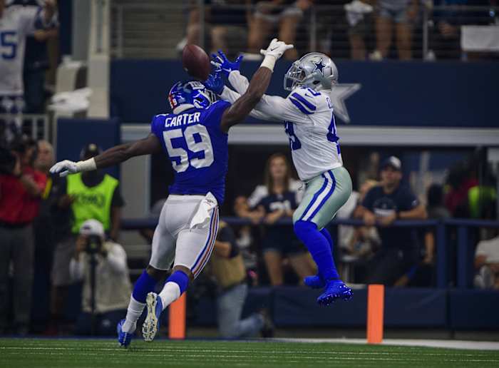 Sep 8, 2019; Arlington, TX, USA; New York Giants linebacker Lorenzo Carter (59) breaks up a pass intended for Dallas Cowboys running back Jamize Olawale (49) during the second quarter at AT&T Stadium.