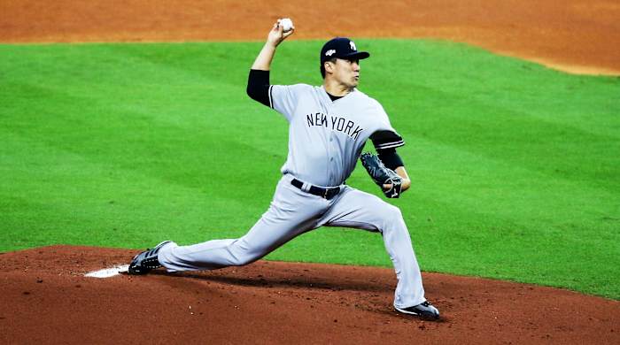 Oct 12, 2019; Houston, TX, USA; New York Yankees starting pitcher Masahiro Tanaka (19) throws against the Houston Astros in the first inning in game one of the 2019 ALCS playoff baseball series at Minute Maid Park. Mandatory Credit: Thomas B. Shea-USA TODAY Sports