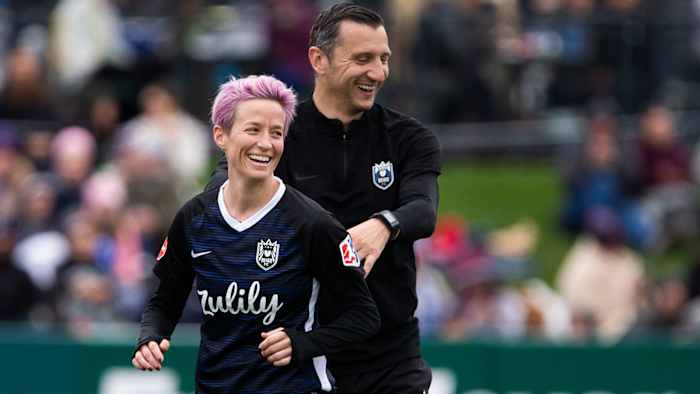 Vlatko Andonovski and Megan Rapinoe of Reign FC