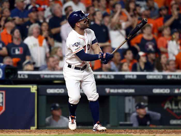 Oct 19, 2019; Houston, TX, USA; Houston Astros second baseman Jose Altuve (27) hits a 2-run walk off home run during the ninth inning against the New York Yankees in game six of the 2019 ALCS playoff baseball series at Minute Maid Park. Mandatory Credit: Troy Taormina-USA TODAY Sports