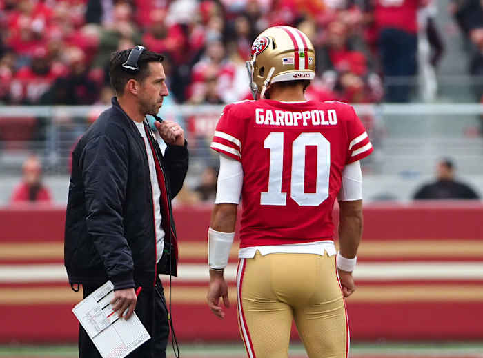 49ers coach Kyle Shanahan talks with quarterback Jimmy Garopollo