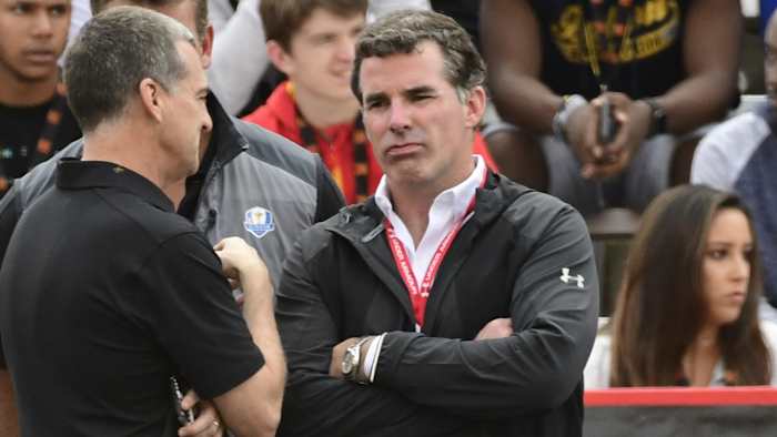 Under Armour CEO Kevin Plank looks on at a University of Maryland basketball game