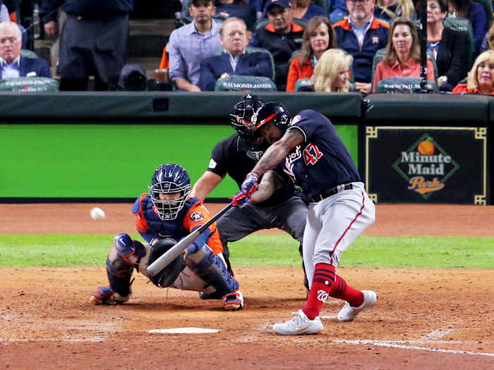 Oct 30, 2019; Houston, TX, USA; Washington Nationals designated hitter Howie Kendrick (47) hits a two-run home run against the Houston Astros during the seventh inning in game seven of the 2019 World Series at Minute Maid Park. Mandatory Credit: Erik Williams-USA TODAY Sports