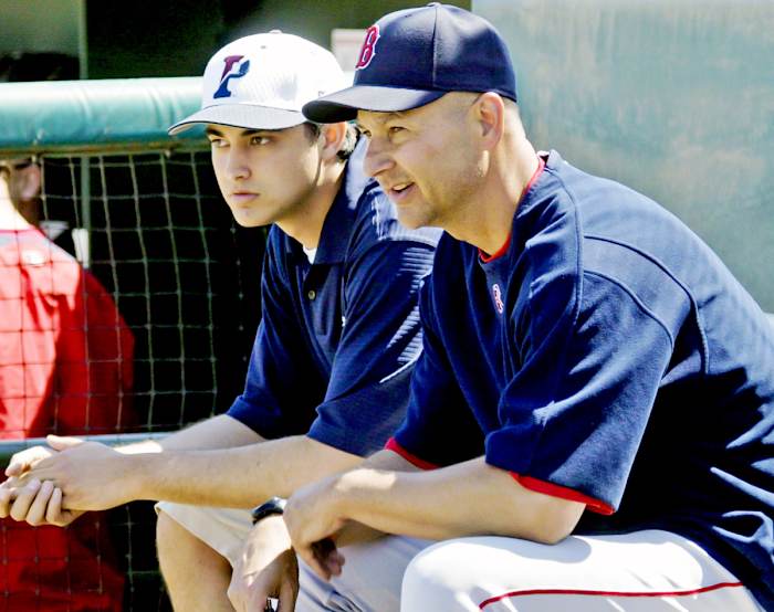 Terry Francona, right, sits with his son, Nick, before a Boston Red Sox spring training game in 2007.