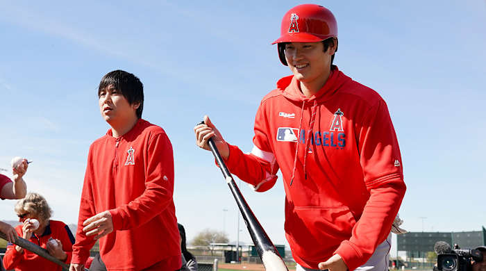 shohei_ohtani_carrying_a_bat_in_angels_gear.jpg