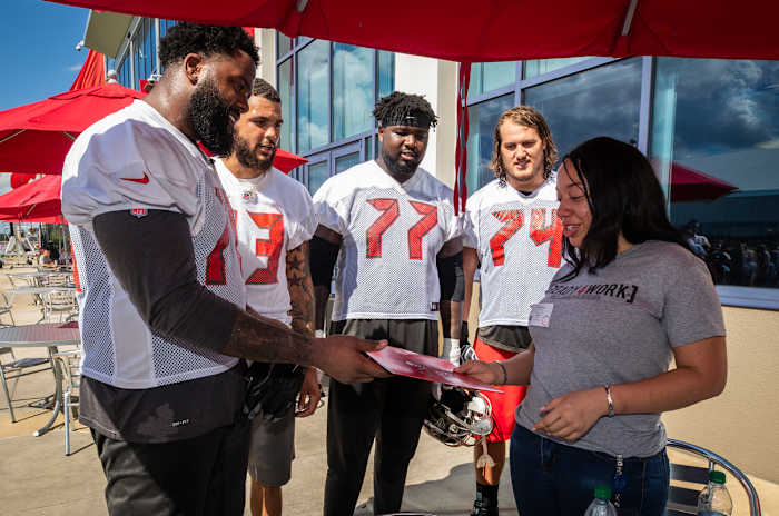 Donovan Smith, Mike Evans, Caleb Benenoch and Ali Marpet with Khadijah Lee.