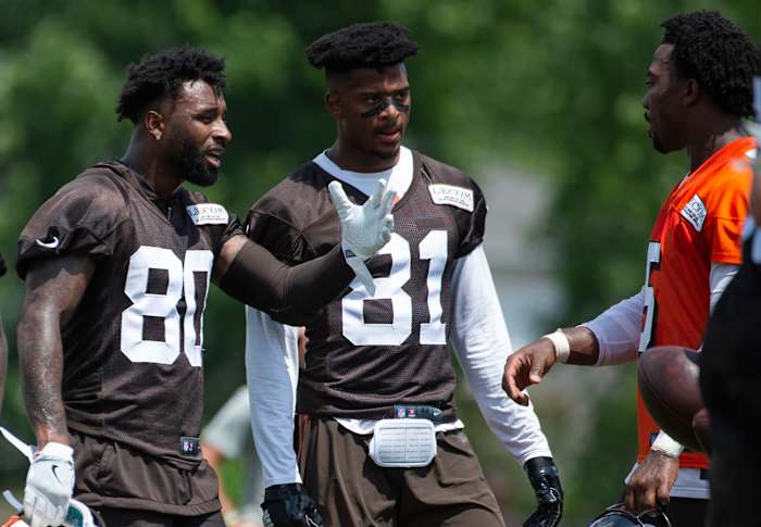 Landry and fellow receiver Rashard Higgins talk to Tyrod Taylor during minincamp.