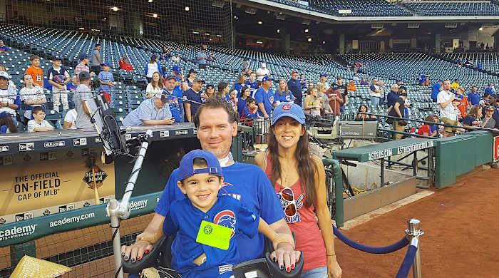 Steve Gleason, his son Rivers and his wife Michel take in a Cubs game.
