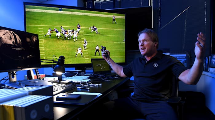 gruden-at-desk-arms-wide.jpg