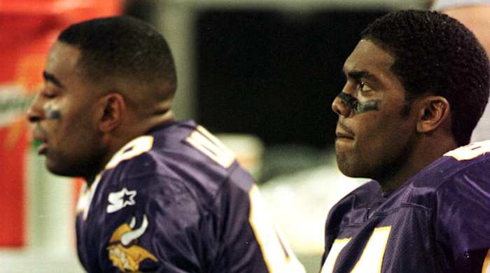 From the bench, Carter and Moss watch their Super Bowl dreams slip away in overtime against the Falcons.