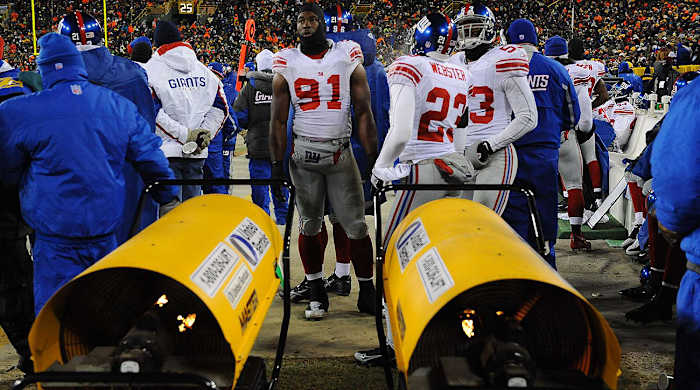 Space around the sideline heaters came at a premium—so much so that some players came away with singed uniforms.