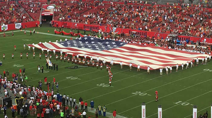 The flag is rolled out in Tampa before Bucs-Browns.