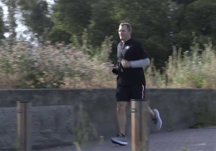 Lynch's morning run from hotel to office, phone in hand.