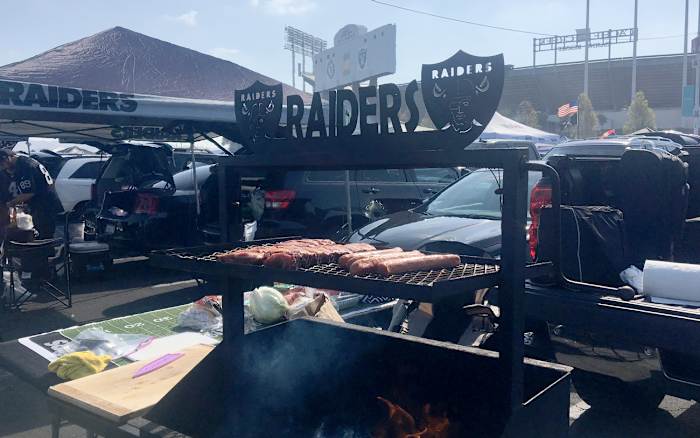 Serious grill, and grilling, outside Oakland-Alameda County Stadium. 