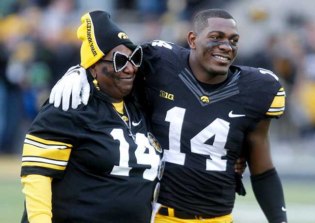 Desmond King and his mom at Iowa's Senior Day ceremonies.