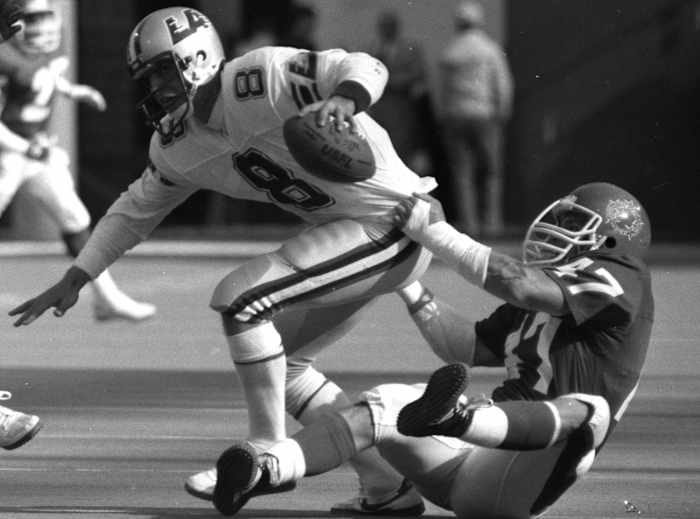 For plenty of players like John Joyce, here wrangling future Hall-of-Famer Steve Young in an ’85 game at the Meadowlands, the USFL was their only taste of the pros.