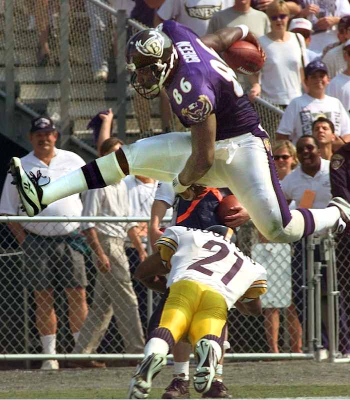 Eric Green goes high over Donnell Woolford in a 1997 game at old Memorial Stadium. 