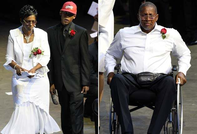 Wright's mother (Deborah), son (Lorenzen Jr.) and father (Herb) at his memorial service in 2010.