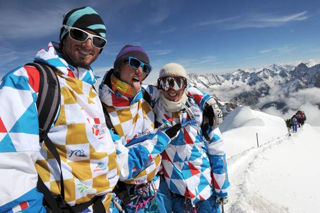 Members of the French national snowboard team (left to right) Tony Mathieu, Crepel Ramoin and Alouan Ricardi pose after reaching the top of the Aiguille du Midi in Chamonix, France.