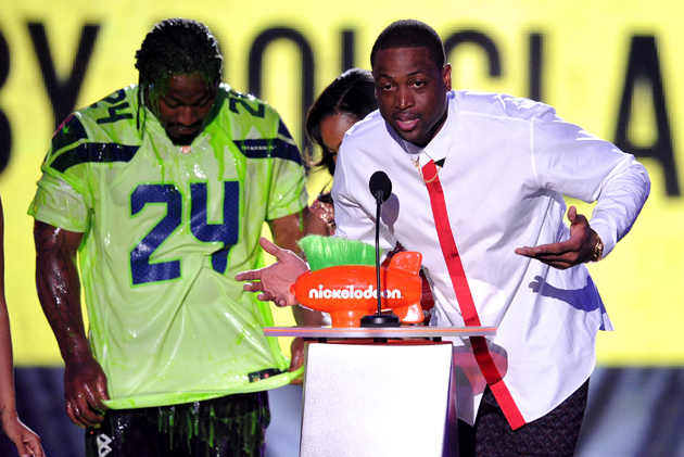 At the Kids Choice Awards, Dwyane Wade accepted "King of Swag" while Marshawn Lynch got slimed.