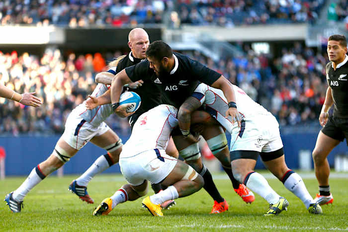 American players display fine rugby tackling form against New Zealand’s Patrick Tuipulotu. (Phil Walter/Getty Images)