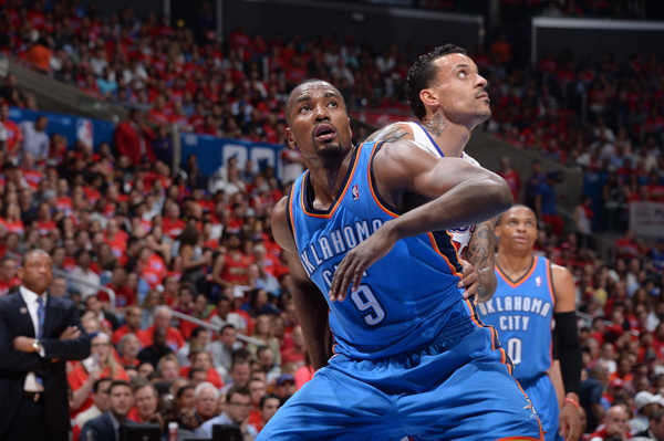 Serge Ibaka (left) is expected to miss the 2014 playoffs with a calf injury. (Andrew D. Bernstein/Getty Images)