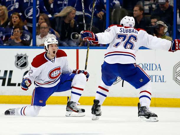Dale Weise (left) and P.K. Subban celebrated after Weise won the game for Montreal in overtime. (Mike Carlson/Getty Images)