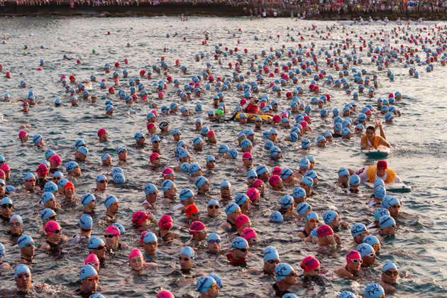 Triathletes await the start of the 2.4 mile swim portion of the Ironman World Championships.