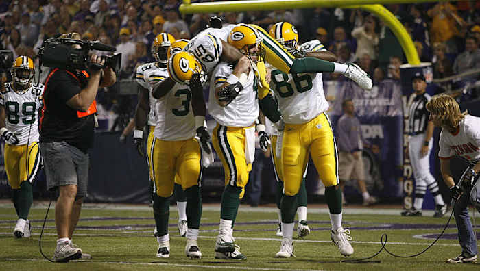 Brett Favre lifted Greg Jennings onto his shoulders after breaking Dan Marino's touchdown record in 2007. (John Biever/Sports Illustrated)