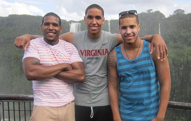 Brogdon stands with his brothers in front of Iguazu Falls in Brazil.