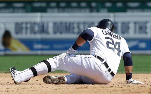 Tigers slugger Miguel Cabrera grabs his leg after sliding into second base. (AP Photo/Paul Sancya