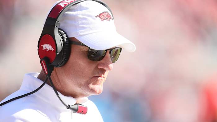 chad morris looks onto the field during an arkansas football game