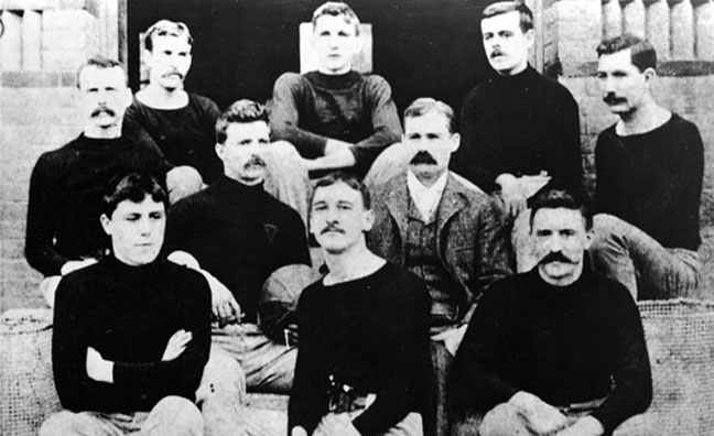 Naismith (center right) with his first basketball team in Springfield, Massachusetts.