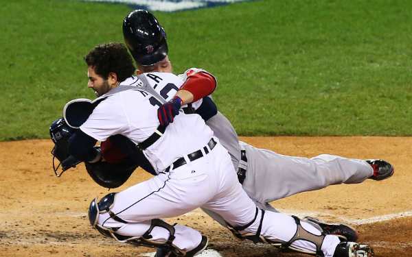 Tigers catcher Alex Avila left Thursday night's Game 5 of the ALCS after this collision. (Ronald Martinez/Getty Images)