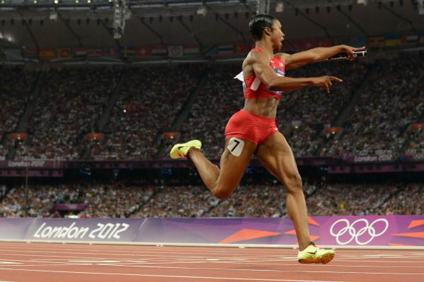 Carmelita Jeter, who helped Team USA to a gold in the 400-meter relay in London, will skip the national championships to nurse a sore quadriceps. (Adrian Dennis/Getty Images)