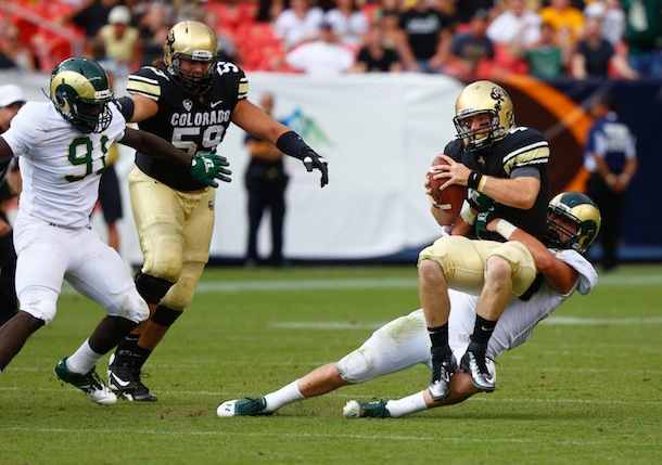 Colorado's Jordan Webb, seen here being arrested in motion by a Colorado State defender, was for-real arrested over the weekend. (AP)