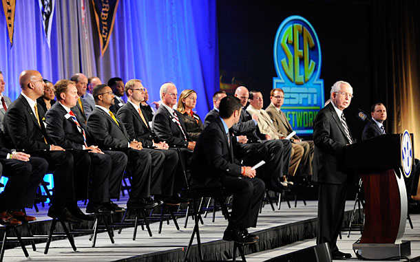 The SEC Network: Not short on money, or coaches who wish they'd worn more comfortable pants to this press conference. (AP)