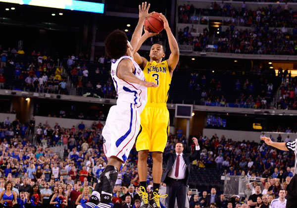 Trey Burke's clutch three from way beyond the three-point line sent the game to overtime, before Michigan pulled out the win. (Greg Nelson/SI)