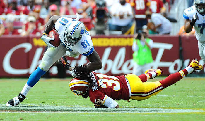 With hits to the head outlawed and drawing heavy punishment, safety Brandon Meriweather has vowed to aim low. That could prove dangerous for receivers like Calvin Johnson. (Jonathan Newton/Getty Images)