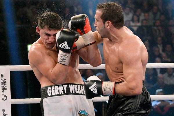 Marco Huck (left) still thinks that he defeated Firat Arslan when they fought in November. (AP)