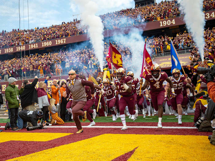 Nov 9, 2019; Minneapolis, MN, USA; Minnesota Golden Gophers head coach P.J. Fleck leads the Minnesota Golden Gophers onto the field before a game against the Penn State Nittany Lions at TCF Bank Stadium. Mandatory Credit: Jesse Johnson-USA TODAY Sports