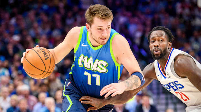 Nov 26, 2019; Dallas, TX, USA; Dallas Mavericks forward Luka Doncic (77) drives to the basket past \LA Clippers guard Patrick Beverley (21) during the first quarter at the American Airlines Center. Mandatory Credit: Jerome Miron-USA TODAY Sports