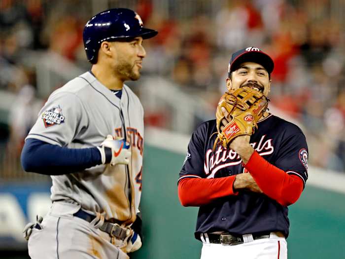 Oct 27, 2019; Washington, DC, USA; Washington Nationals third baseman Anthony Rendon (6) and Houston Astros center fielder George Springer (4) talk during the eighth inning in game five of the 2019 World Series at Nationals Park. Mandatory Credit: Geoff Burke-USA TODAY Sports