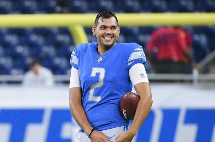 Detroit Lions kicker Matt Prater (5) and punter Ryan Santoso (2) looks on before a game against the New York Giants at Ford Field.