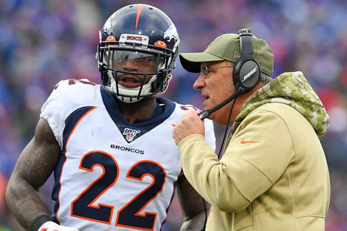 Denver Broncos head coach Vic Fangio talks with strong safety Kareem Jackson (22) during a time-out against the Buffalo Bills during the second quarter at New Era Field.