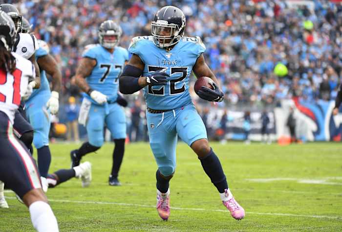 Tennessee Titans running back Derrick Henry (22) runs for a short gain during the second half against the Houston Texans at Nissan Stadium.