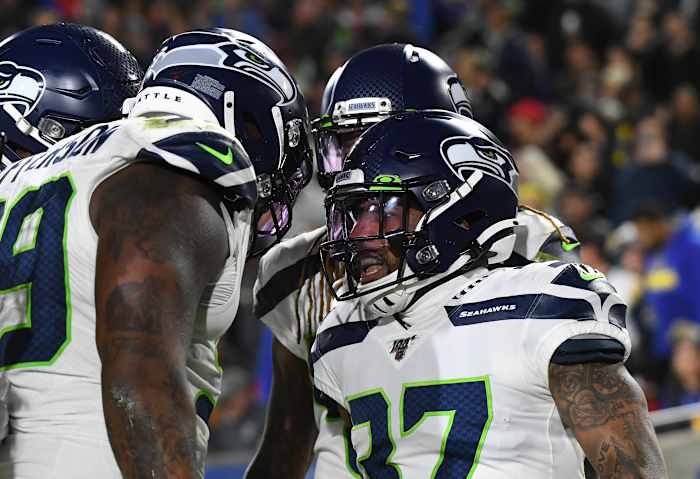 Seattle Seahawks defensive back Quandre Diggs (37) celebrates returning an interception for a touchdown against the Los Angeles Rams in the second half of a NFL game at Los Angeles Memorial Coliseum.