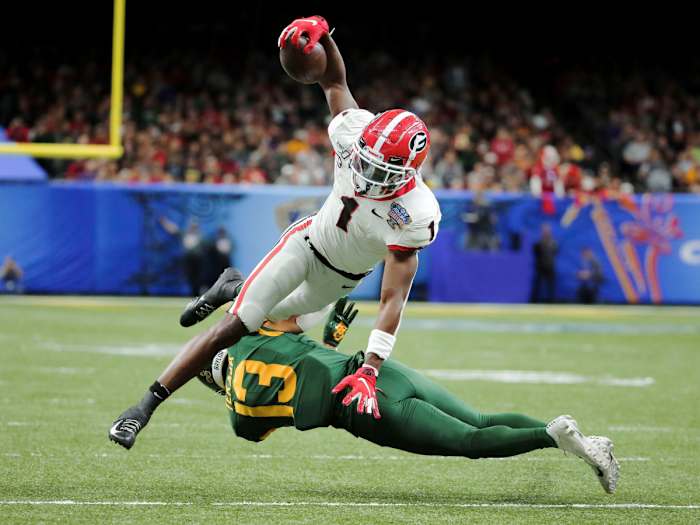 Jan 1, 2020; New Orleans, Louisiana, USA;  Georgia Bulldogs wide receiver George Pickens (1) leaps over Baylor Bears cornerback Raleigh Texada (13) during the second quarter at the Mercedes-Benz Superdome.